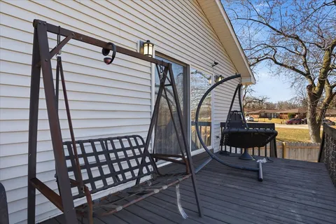 a view of a chairs on the roof deck