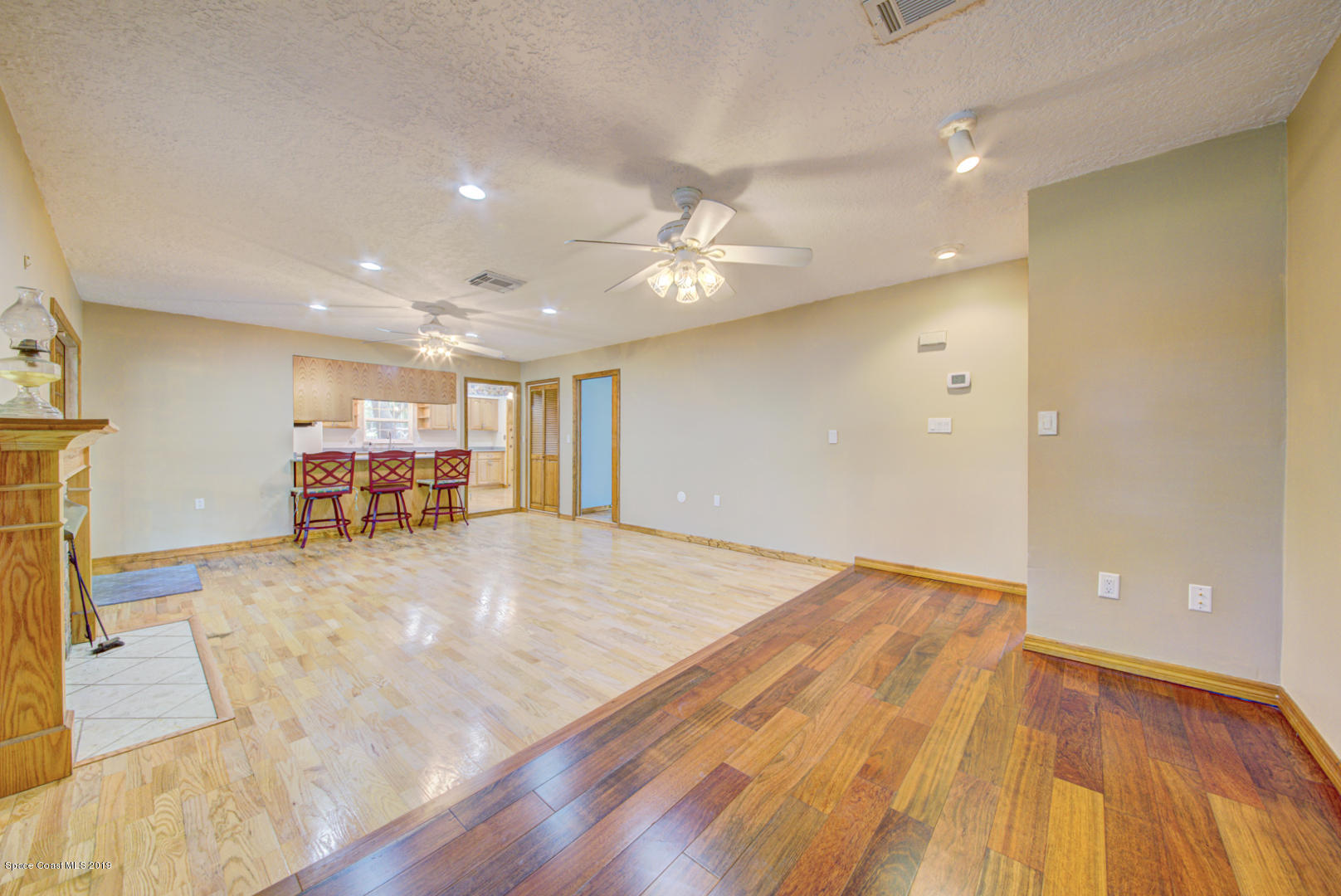 2665 Wagon Road Cocoa, FL 32926 - Photo 12 of 61 family room with wood floors