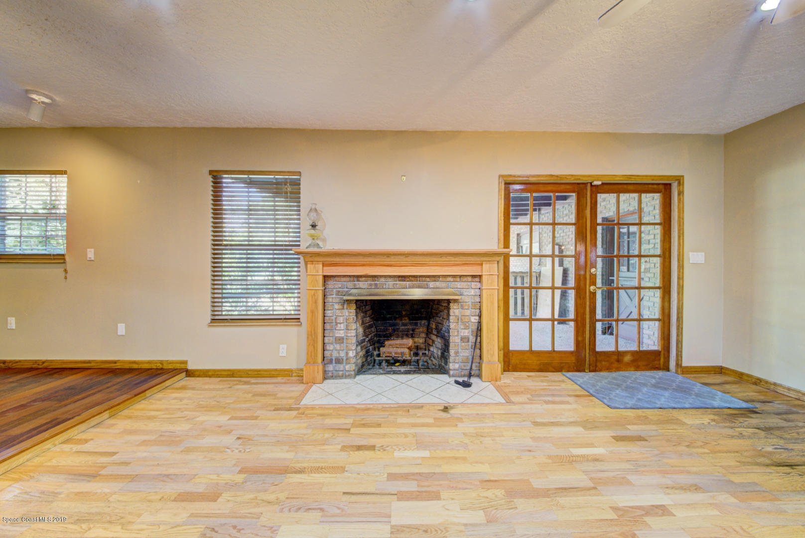 2665 Wagon Road Cocoa, FL 32926 - Photo 14 of 61 family room with fireplace