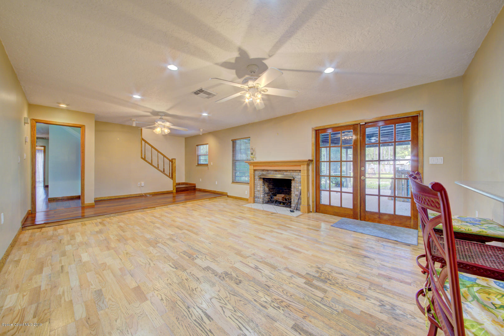 2665 Wagon Road Cocoa, FL 32926 - Photo 15 of 61 family room with french doors to porch