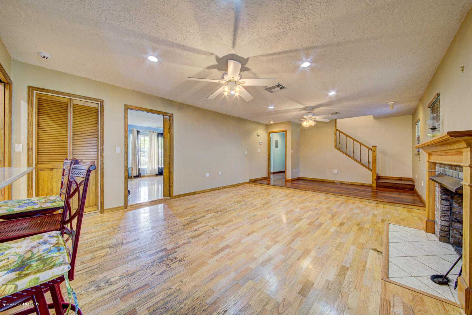 2665 Wagon Road Cocoa, FL 32926 - Photo 16 of 61 family room & staircase