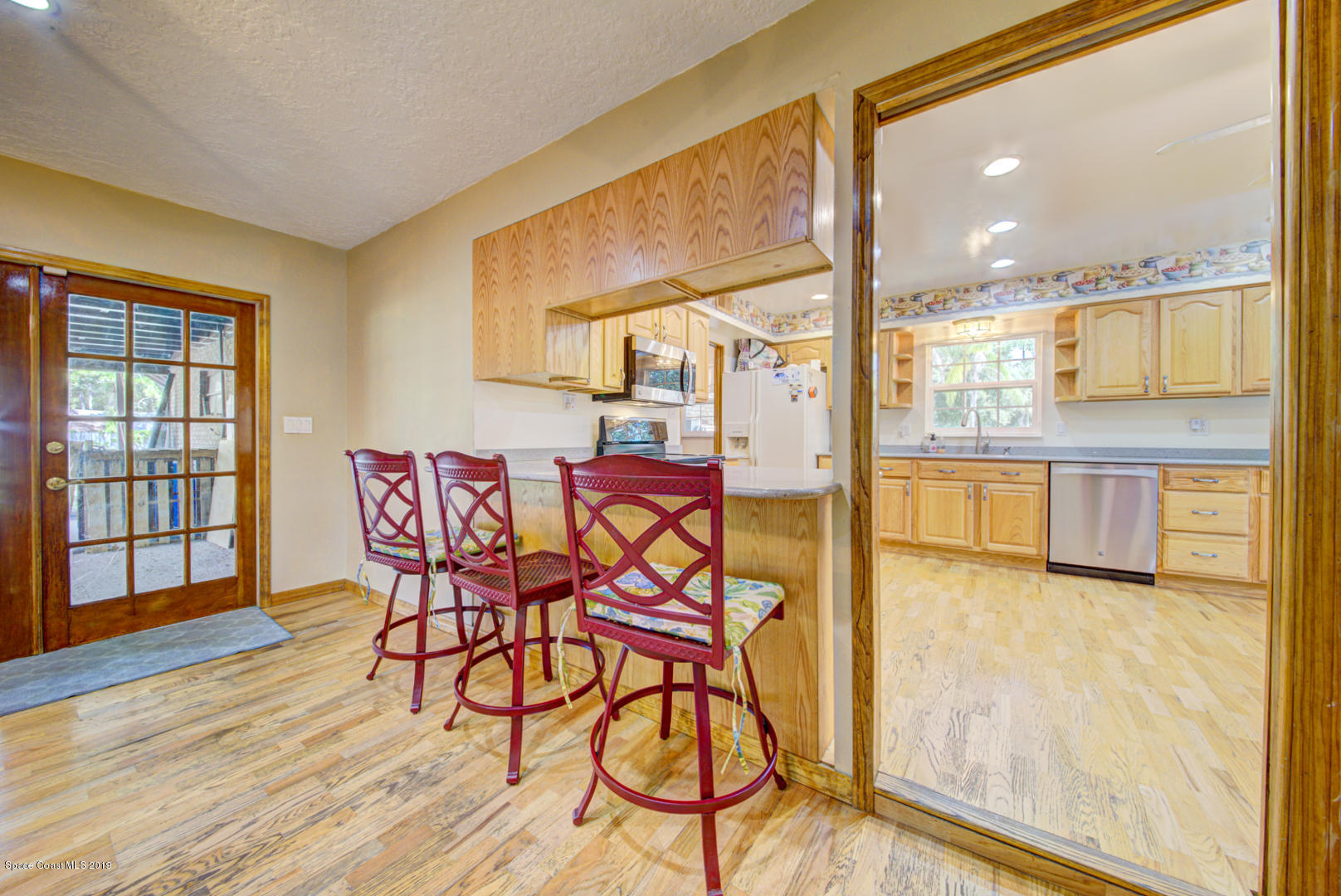 2665 Wagon Road Cocoa, FL 32926 - Photo 17 of 61 family room & breakfast bar