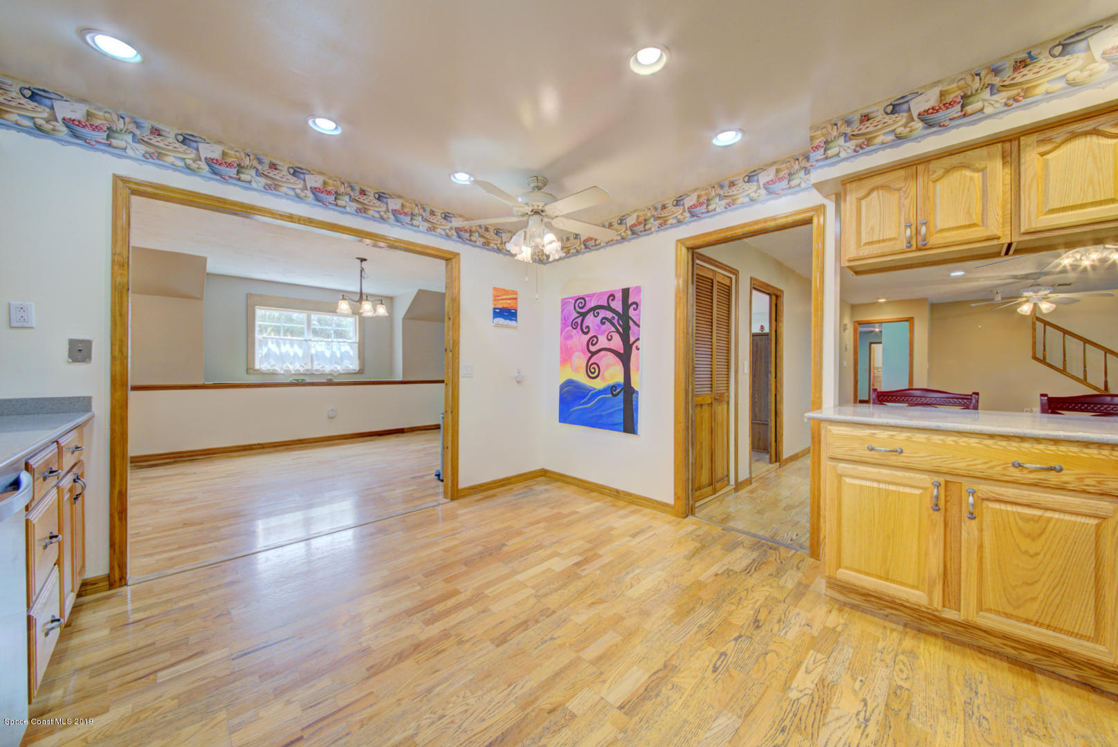 2665 Wagon Road Cocoa, FL 32926 - Photo 22 of 61 kitchen open to dining room