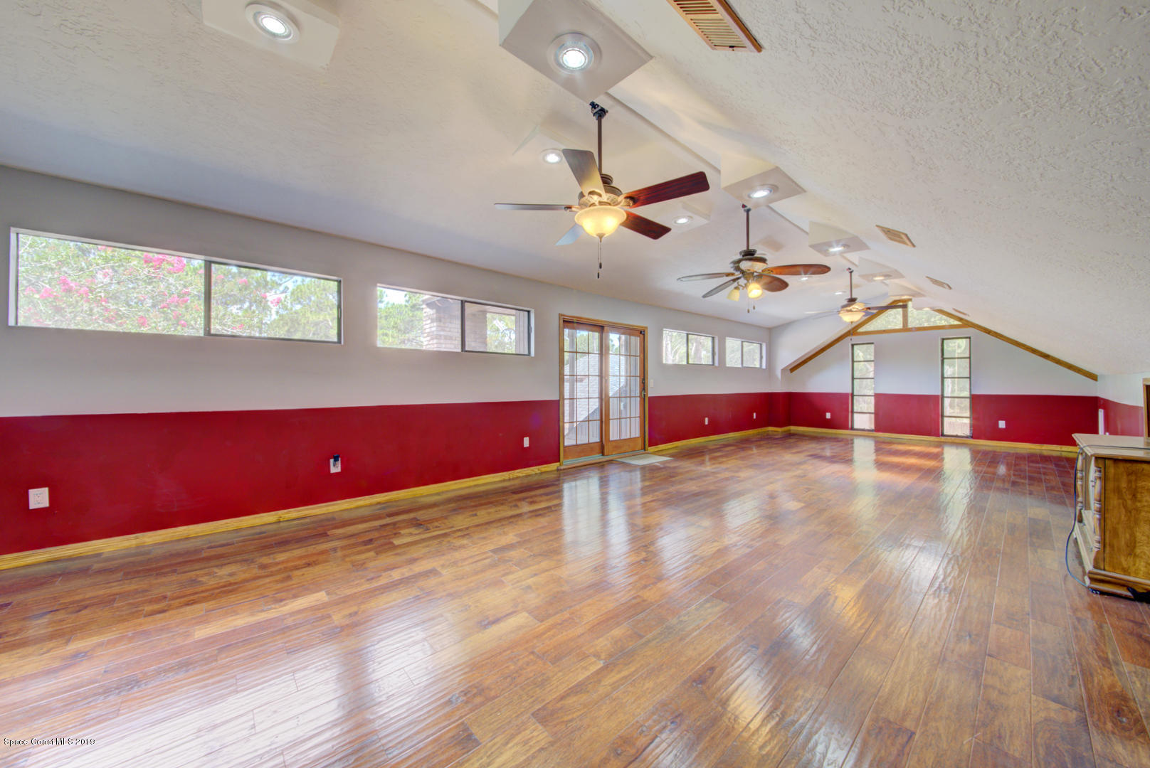 2665 Wagon Road Cocoa, FL 32926 - Photo 47 of 61 bonus room with sliding doors to roof de