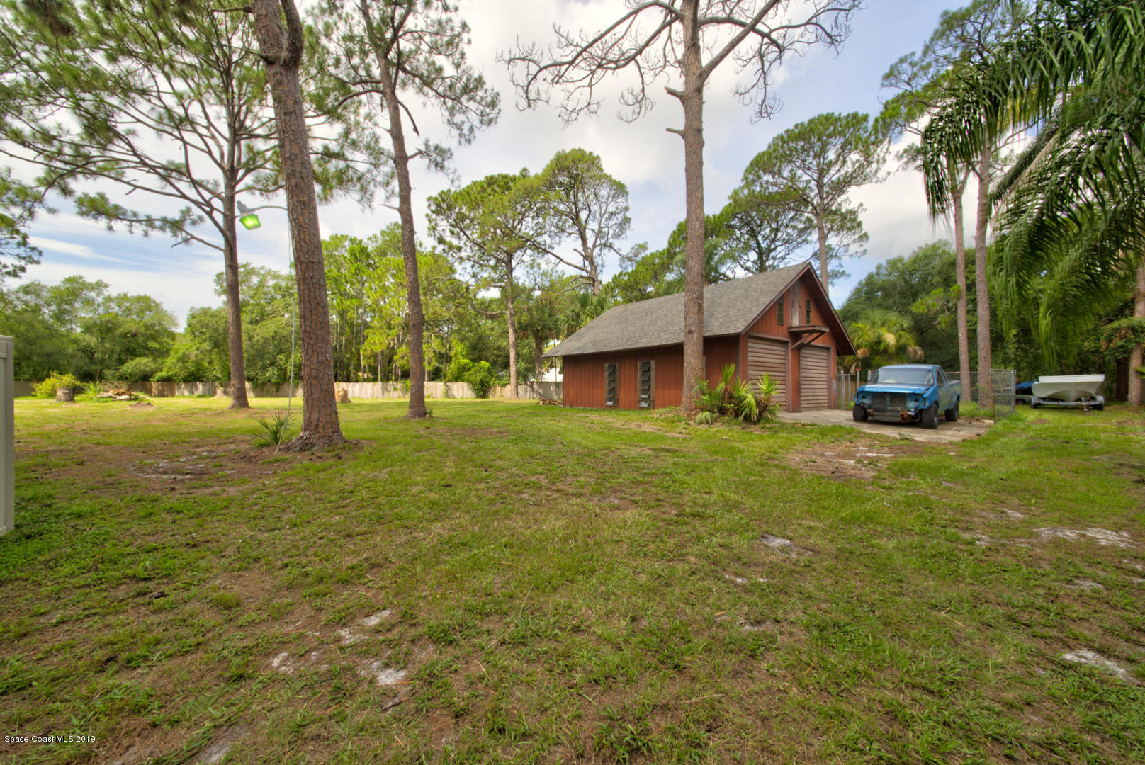 2665 Wagon Road Cocoa, FL 32926 - Photo 54 of 61 backyard with outbuilding