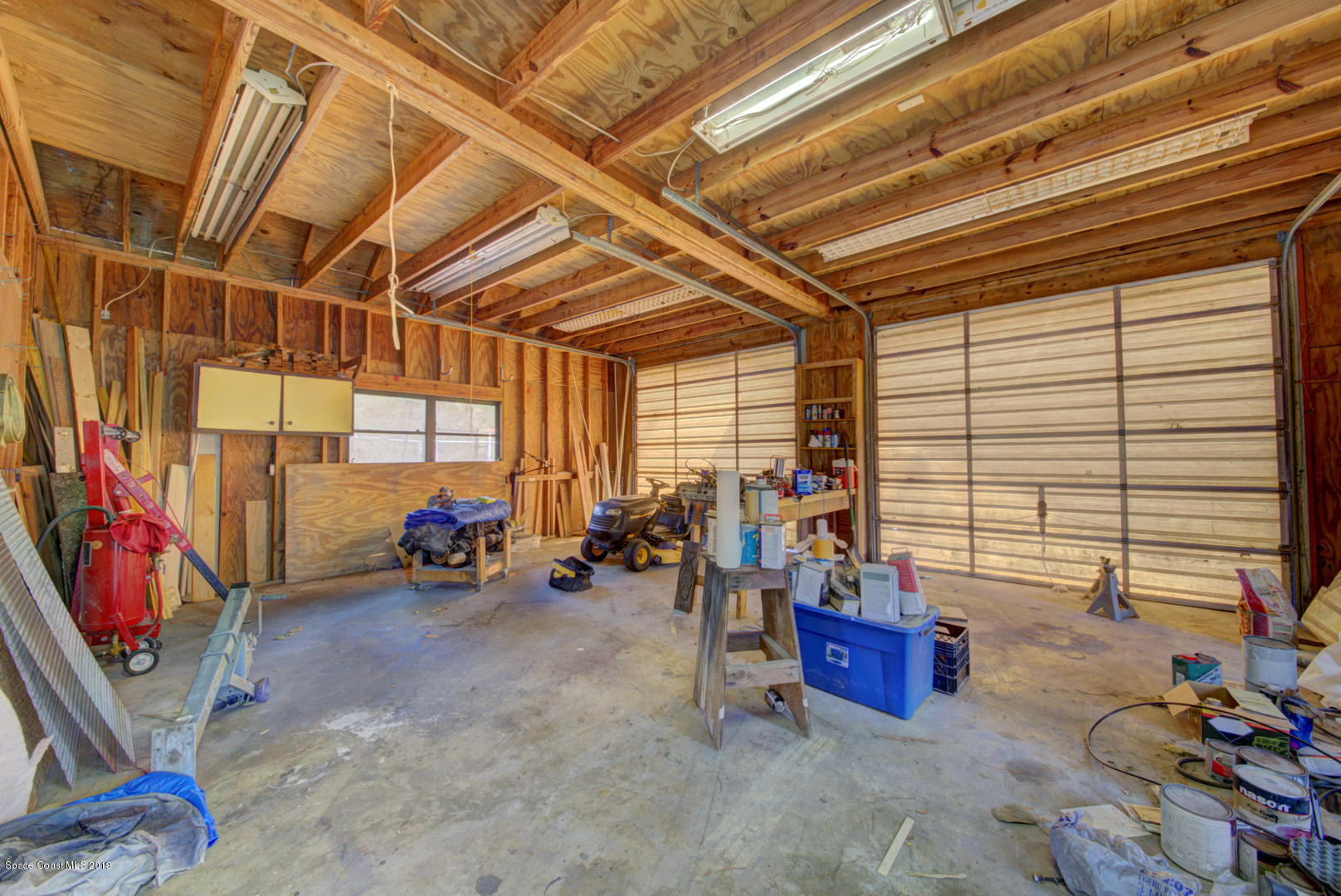 2665 Wagon Road Cocoa, FL 32926 - Photo 58 of 61 outbuilding with garage doors