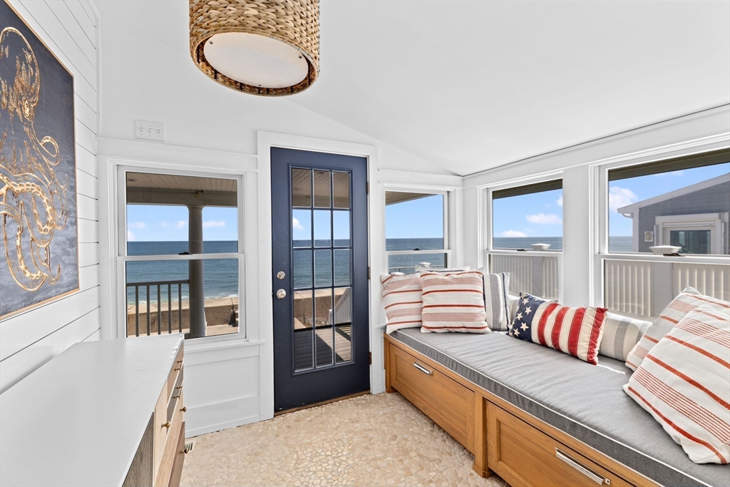 57 Surfside Road Scituate, MA 02066 - Photo 17 of 39 a living room with furniture and a large window