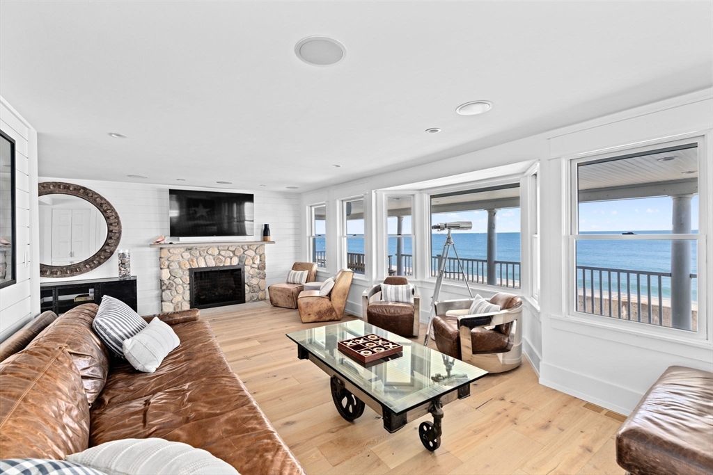 57 Surfside Road Scituate, MA 02066 - Photo 18 of 39 a living room with furniture fireplace and a table