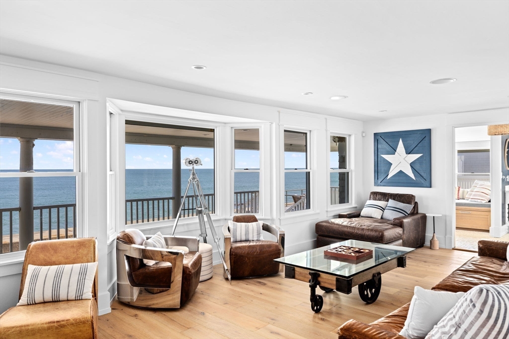 57 Surfside Road Scituate, MA 02066 - Photo 20 of 39 a living room with furniture and a floor to ceiling window