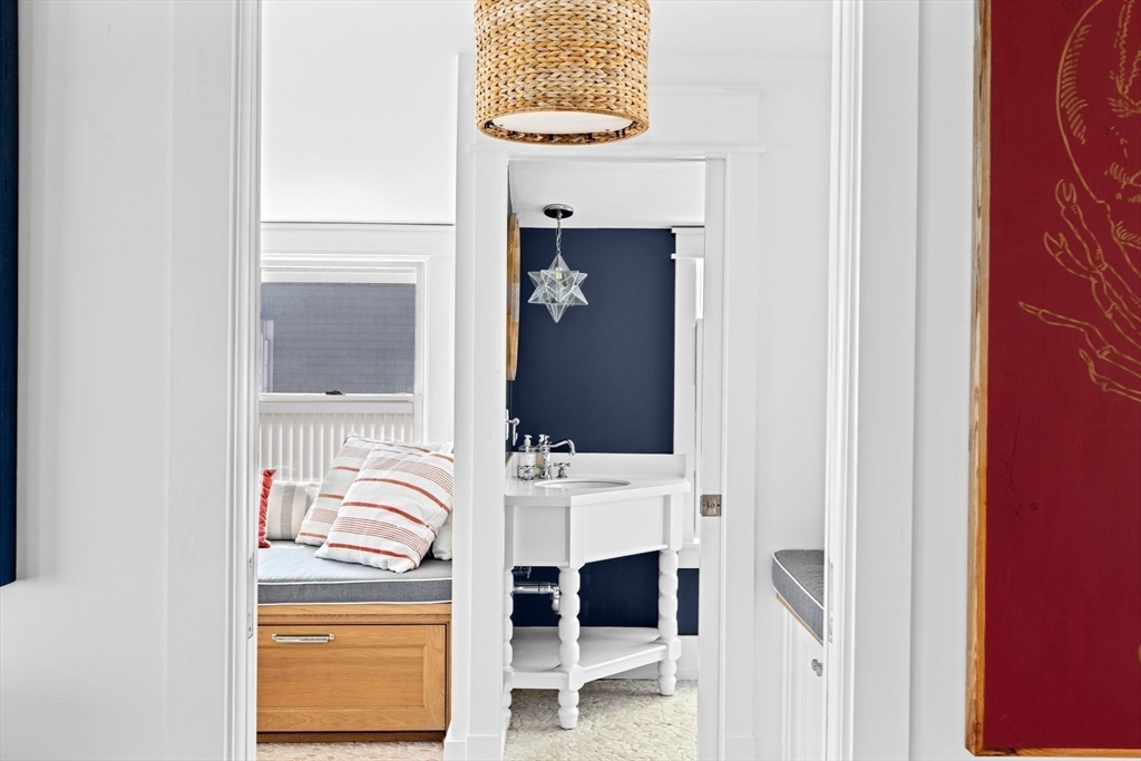 57 Surfside Road Scituate, MA 02066 - Photo 26 of 39 a bathroom with a sink and a mirror