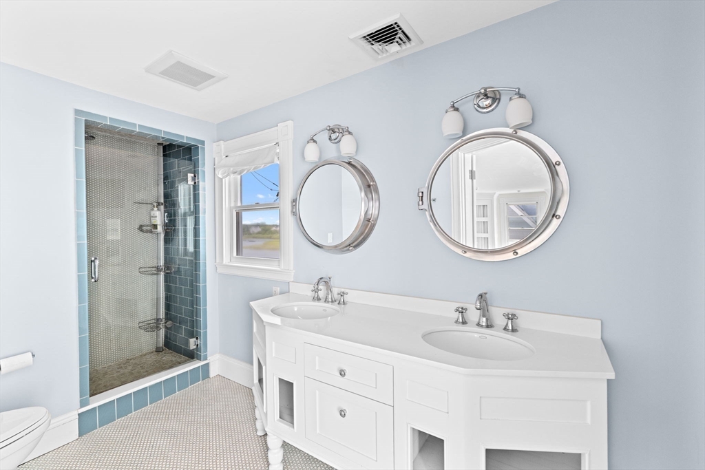 57 Surfside Road Scituate, MA 02066 - Photo 28 of 39 a bathroom with a double vanity sink mirror and shower