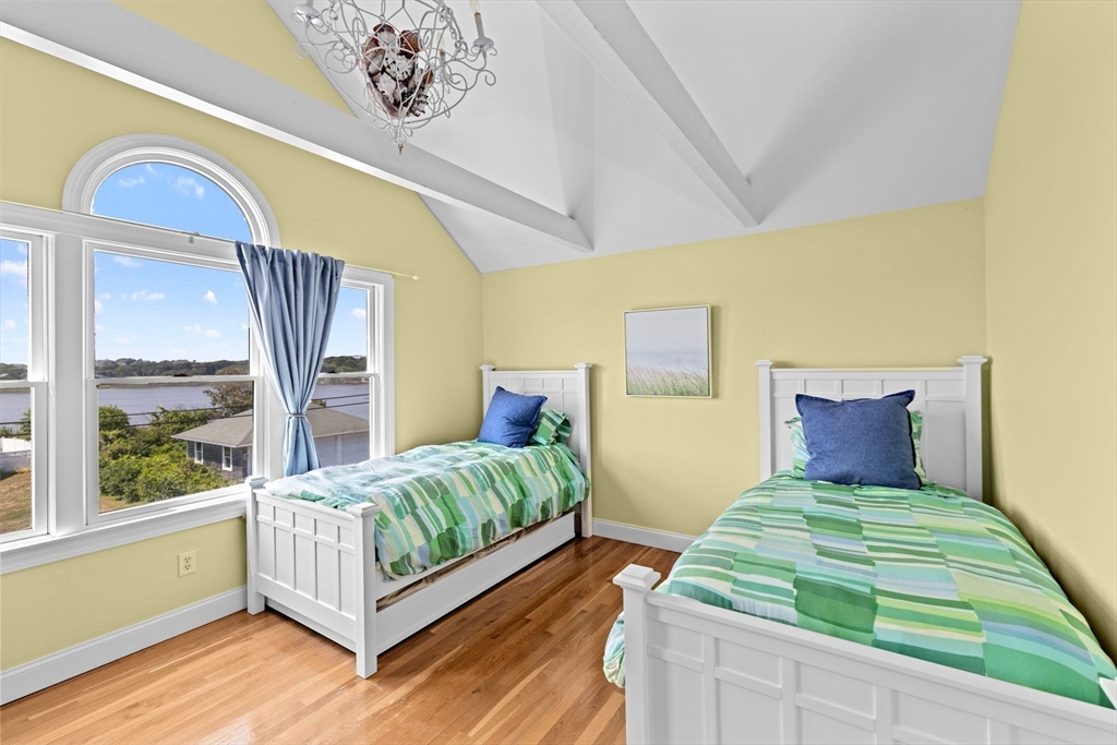 57 Surfside Road Scituate, MA 02066 - Photo 30 of 39 a bedroom with 2 bed and a window