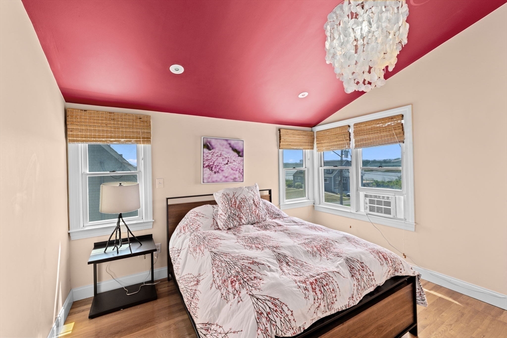 57 Surfside Road Scituate, MA 02066 - Photo 32 of 39 a bedroom with a bed and a window