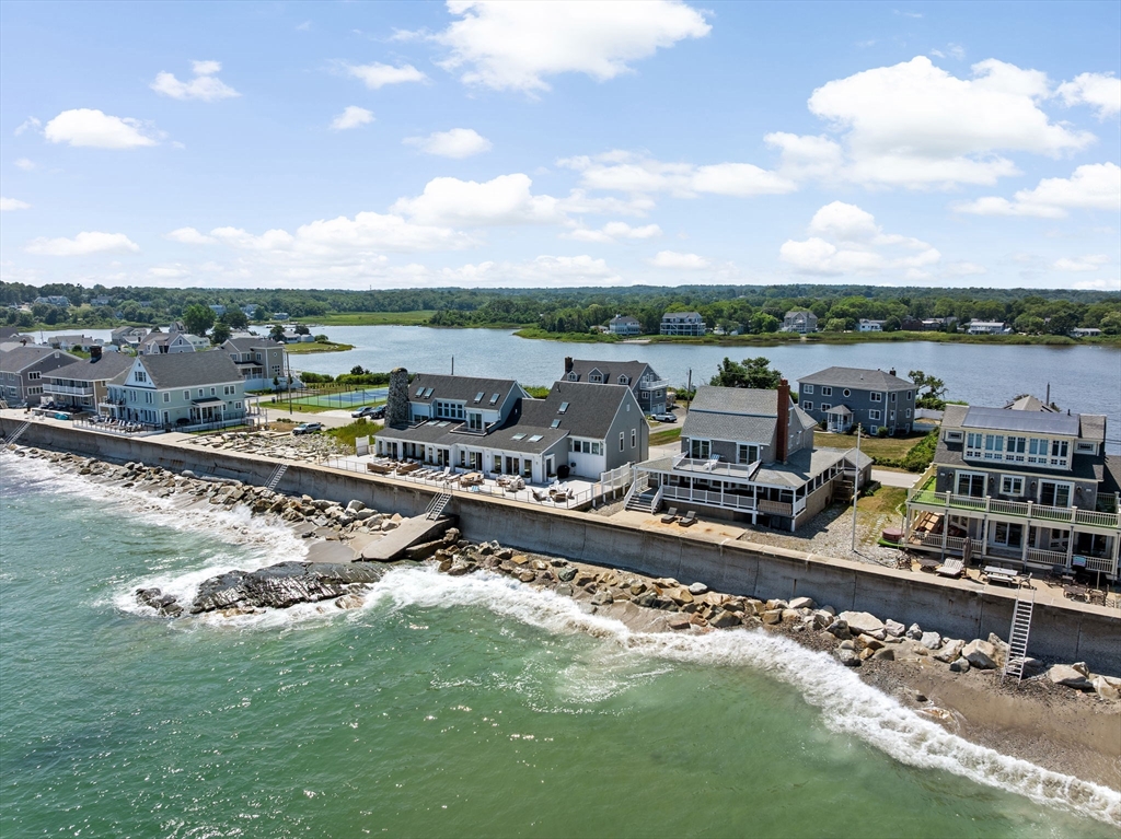 57 Surfside Road Scituate, MA 02066 - Photo 5 of 39 a view of a lake with a nearby beach