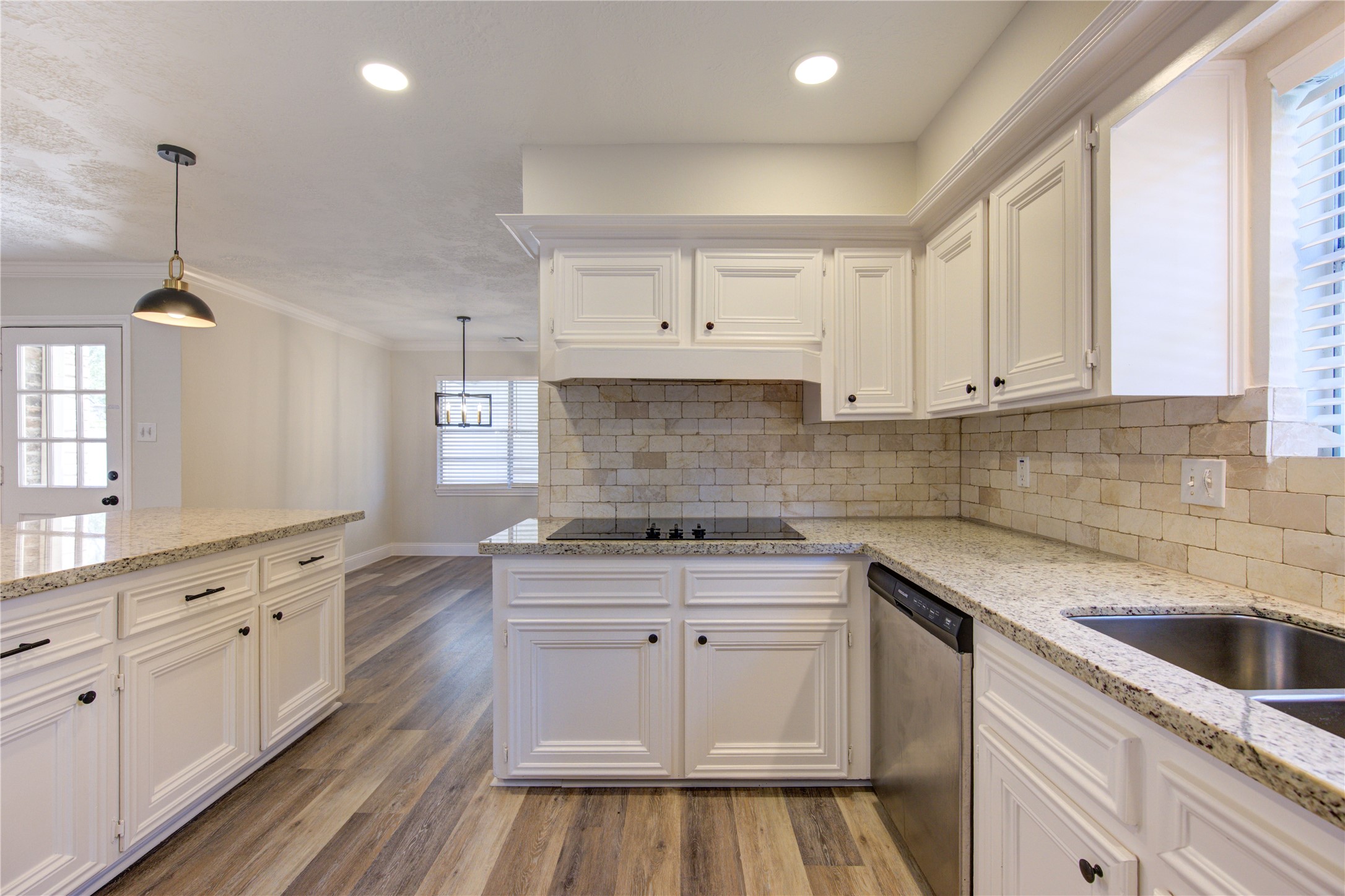 9115 Taidswood Drive Spring, TX 77379 - Photo 18 of 45 There is an enormous amount of cabinet/storage space for all your culinary necessities. The kitchen has new LED recessed lighting, a deep double stainless sink, and new pendant lighting.