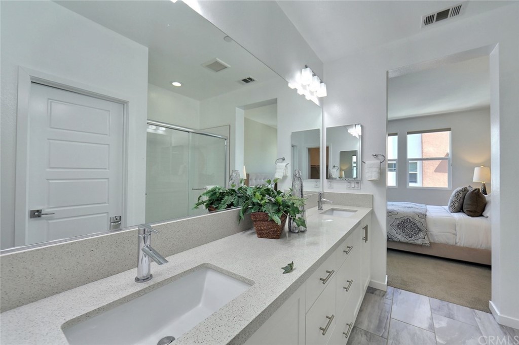 714 Brooklyn Drive Brea, CA 92821 - Photo 18 of 31 a bathroom with a double vanity sink and a mirror