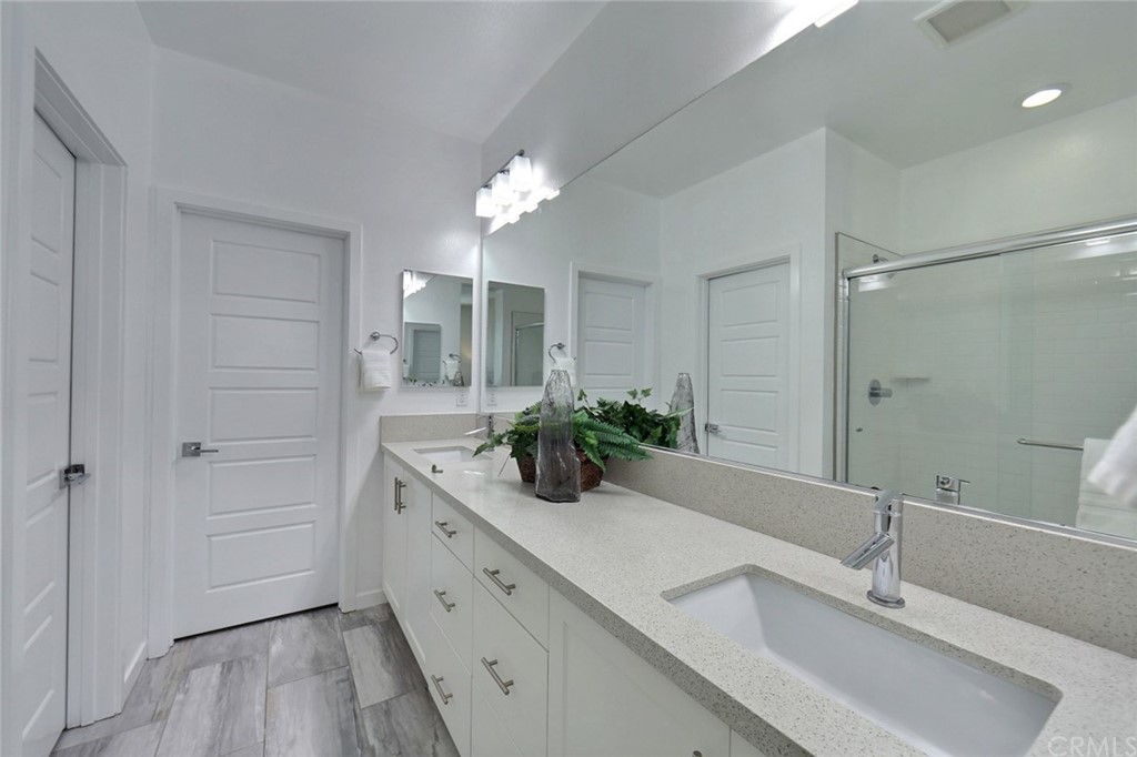 714 Brooklyn Drive Brea, CA 92821 - Photo 19 of 31 a bathroom with a double vanity sink and a mirror
