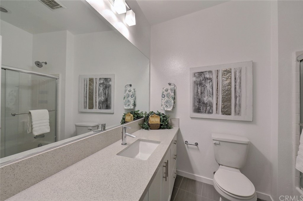714 Brooklyn Drive Brea, CA 92821 - Photo 22 of 31 a bathroom with a granite countertop sink mirror vanity and toilet