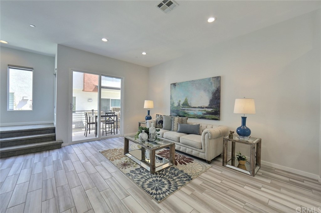 714 Brooklyn Drive Brea, CA 92821 - Photo 6 of 31 a living room with furniture and a wooden floor