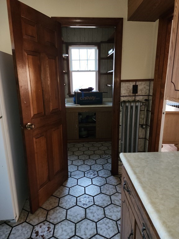 57 Austin Street, Unit 2 Boston, MA 02136 - Photo 9 of 17 a kitchen with a sink and a refrigerator
