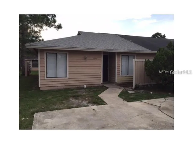 a view of a backyard of the house