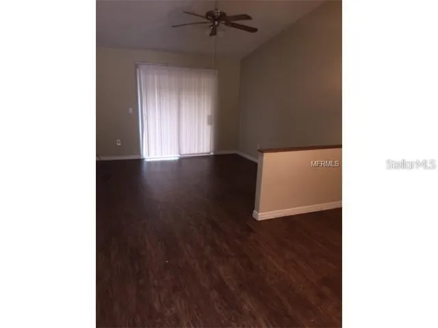 a view of a livingroom with wooden floor