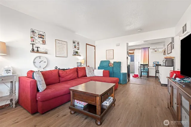 a living room with furniture and a window