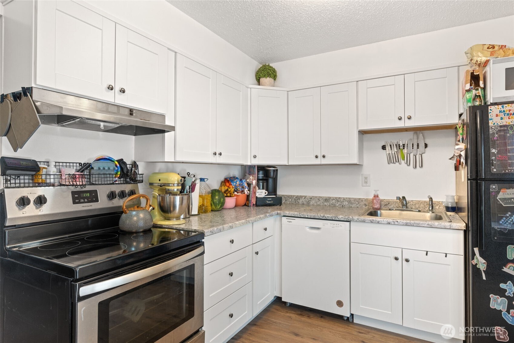 1149 Southwest Cascade Avenue Chehalis, WA 98532 - Photo 16 of 31 a kitchen with white cabinets and appliances