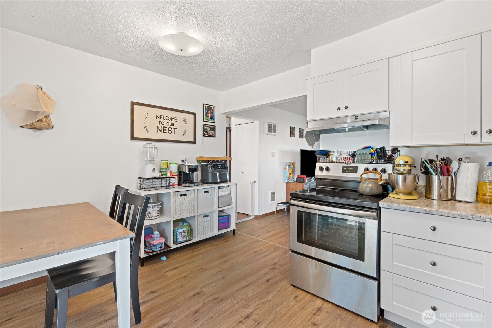 1149 Southwest Cascade Avenue Chehalis, WA 98532 - Photo 19 of 31 a kitchen with white cabinets and stainless steel appliances