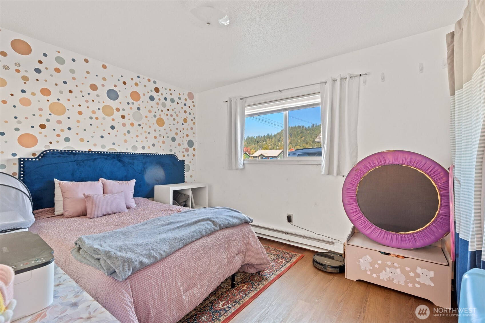 1149 Southwest Cascade Avenue Chehalis, WA 98532 - Photo 21 of 31 a bedroom with a bed and a painting on the wall