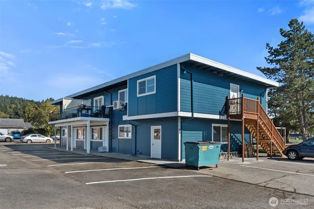 a room with water heater table and chairs