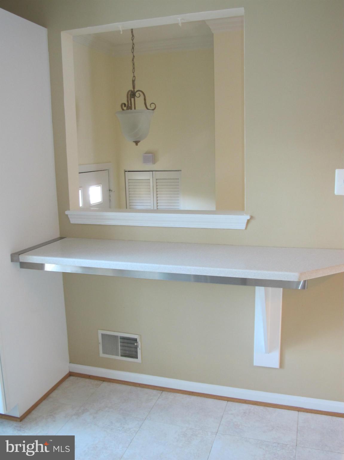 7726 Asterella Court Springfield, VA 22152 - Photo 4 of 22 a bathroom with a sink and a mirror