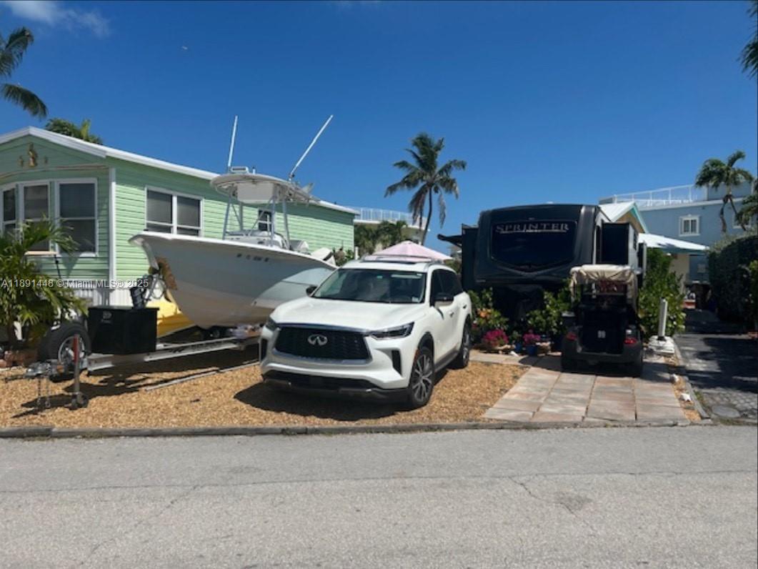 a front view of a house with sitting area
