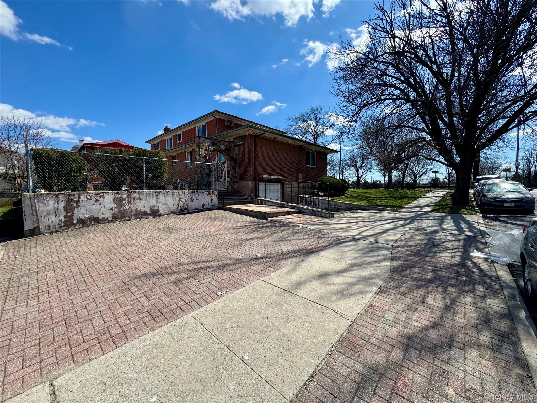 15035 116th Street Queens, NY 11420 - Photo 6 of 8 a view of a house with a yard