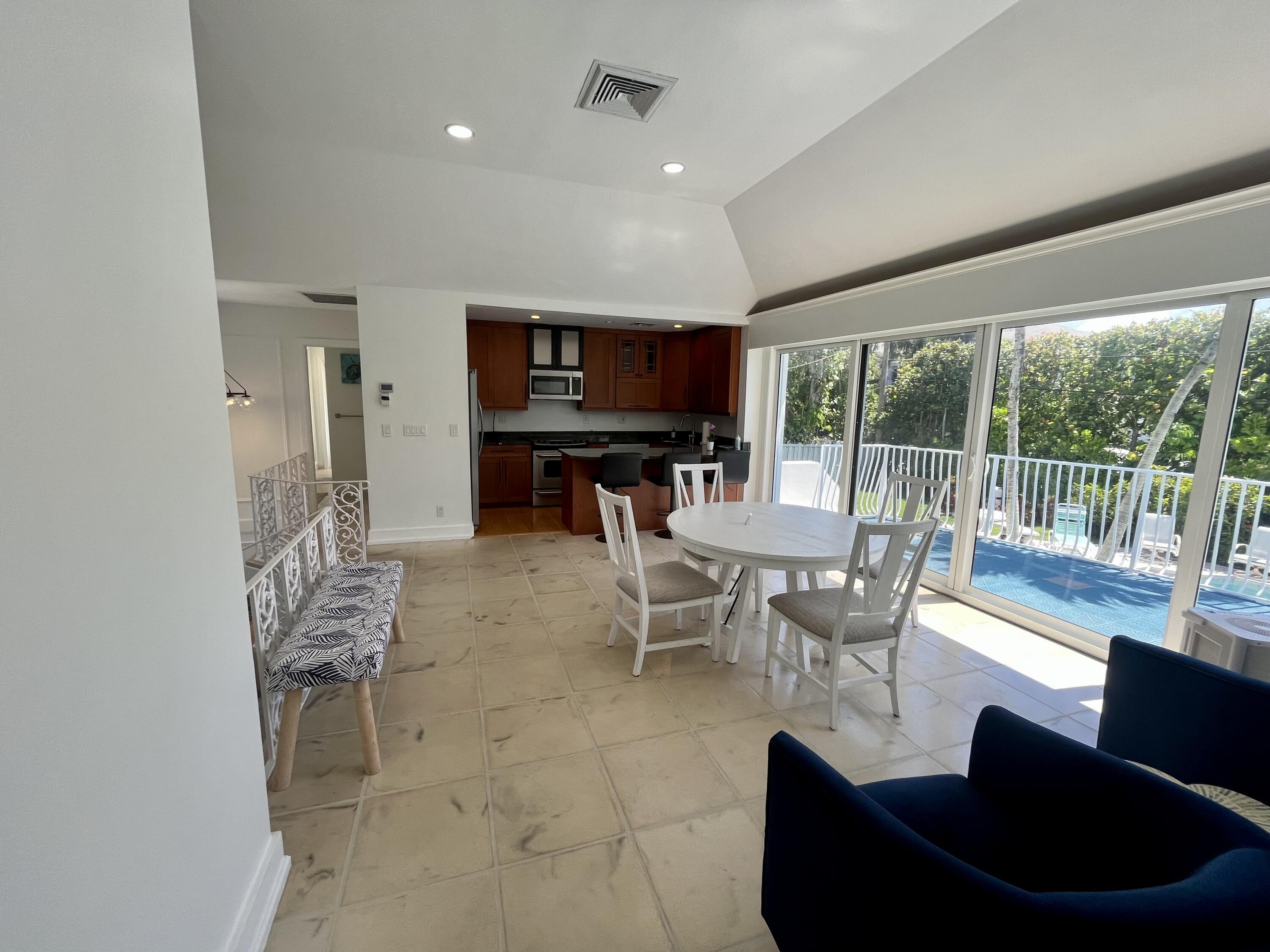 115 Dolphin Road Ocean Ridge, FL 33435 - Photo 29 of 38 a living room with furniture and a large window