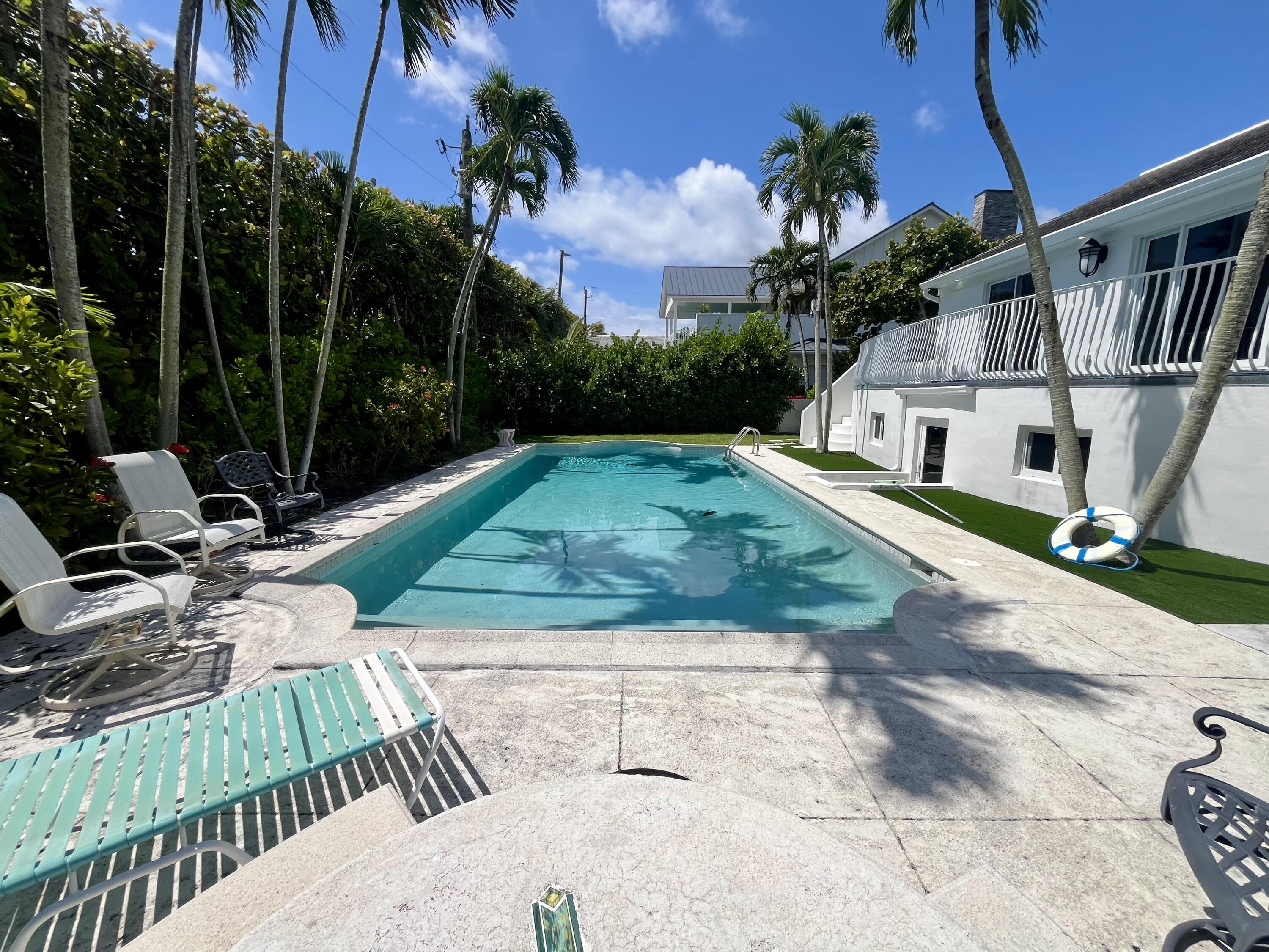 115 Dolphin Road Ocean Ridge, FL 33435 - Photo 35 of 38 a view of backyard with swimming pool and seating space