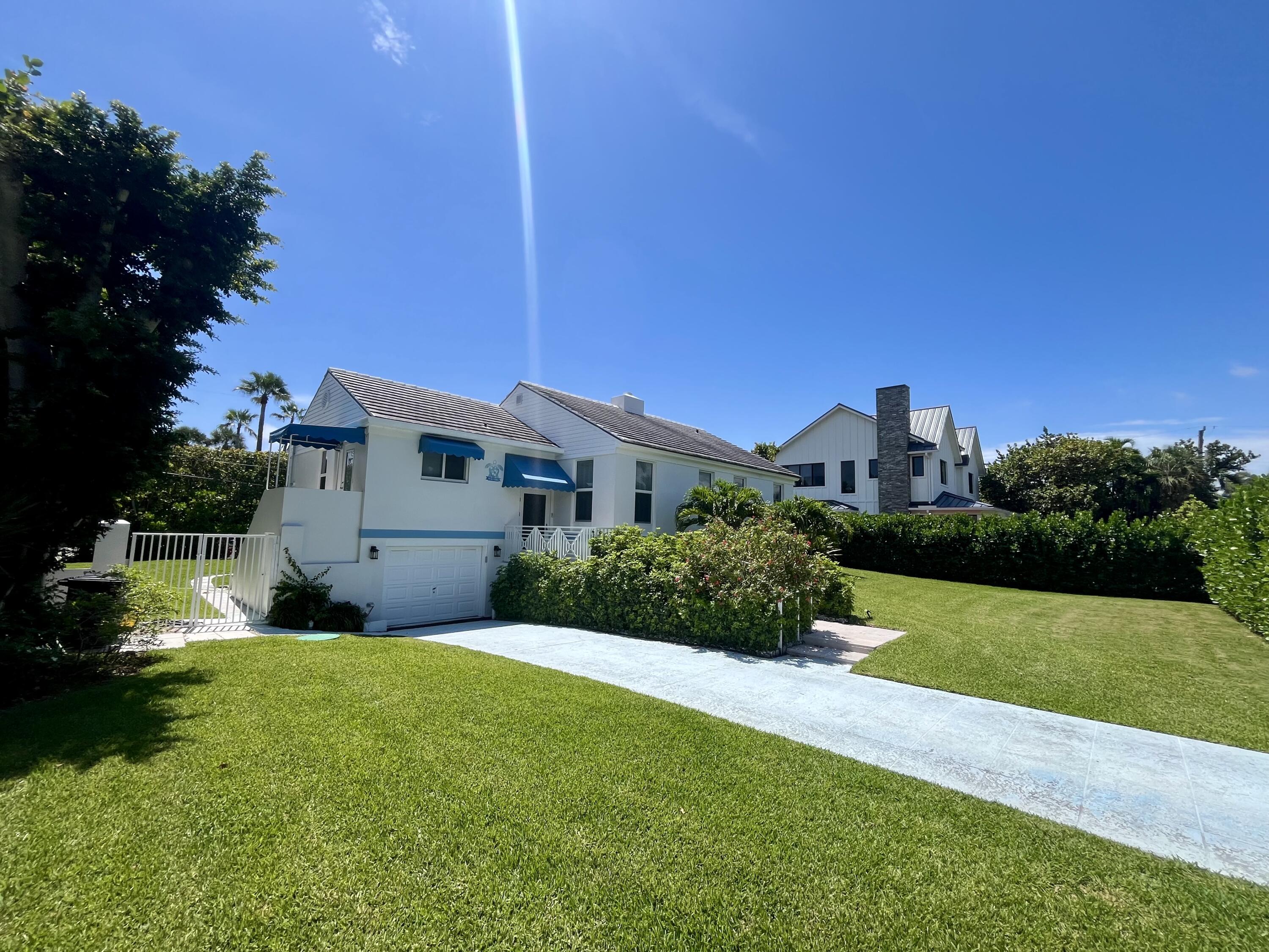 115 Dolphin Road Ocean Ridge, FL 33435 - Photo 4 of 38 a view of a house with a yard