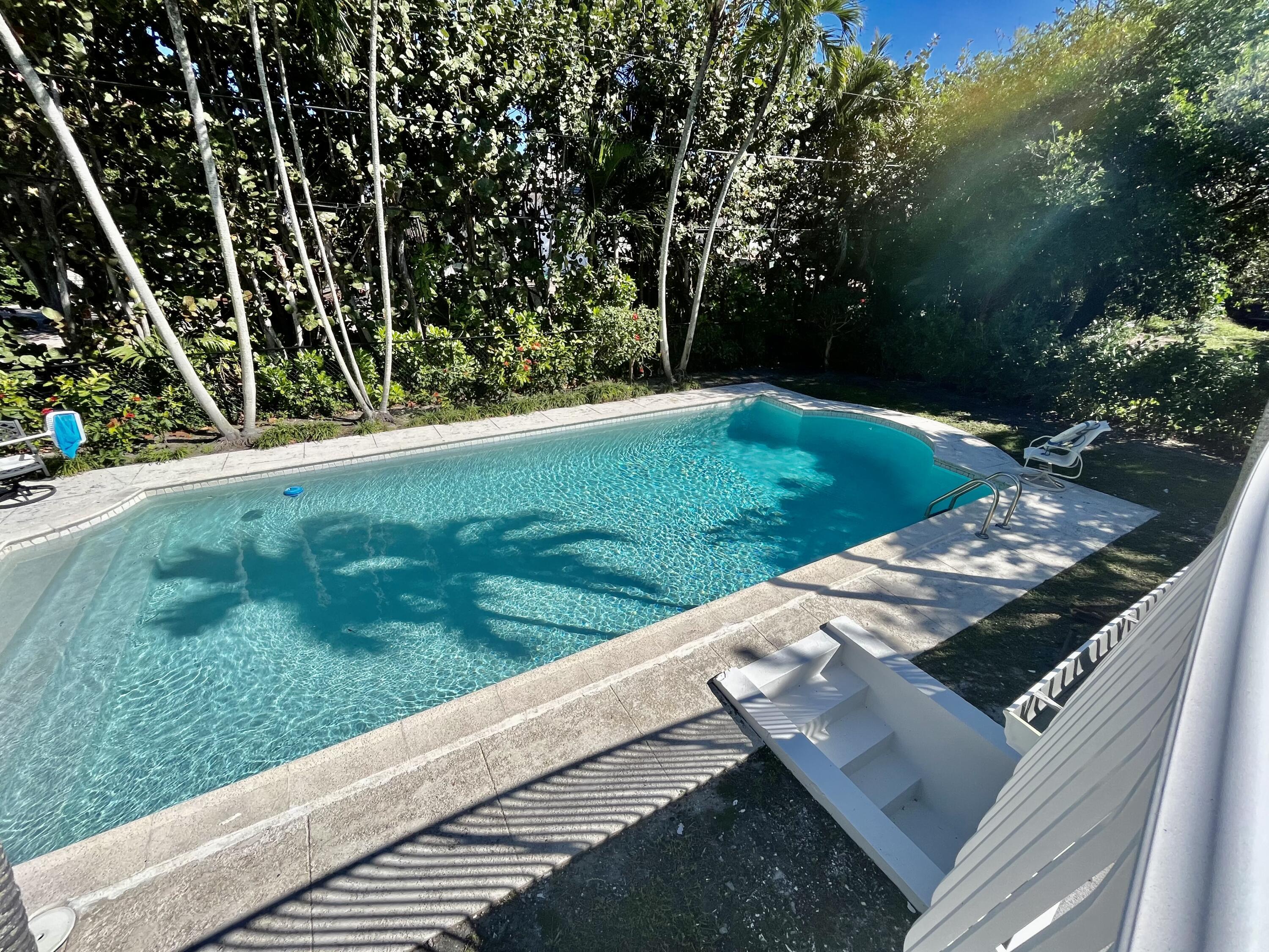 115 Dolphin Road Ocean Ridge, FL 33435 - Photo 6 of 38 a view of a yard with an outdoor space