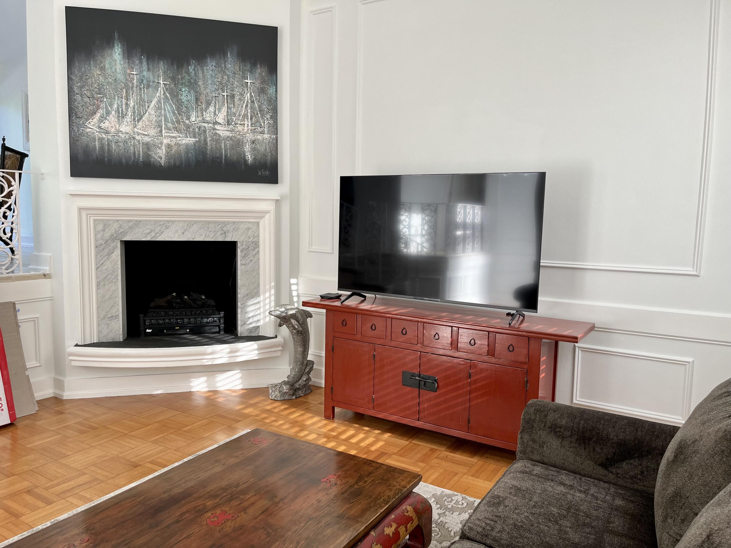 115 Dolphin Road Ocean Ridge, FL 33435 - Photo 9 of 38 a living room with furniture and a flat screen tv