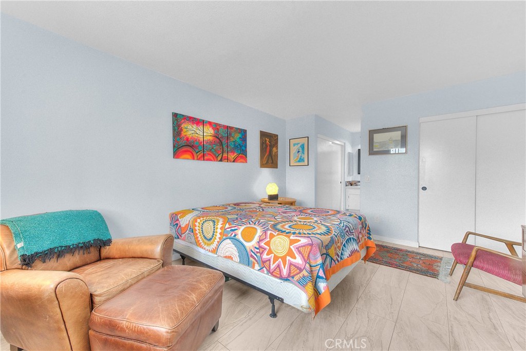 6351 Riverside Drive, Unit 69 Chino, CA 91710 - Photo 12 of 21 a bedroom with two beds and painting on the wall