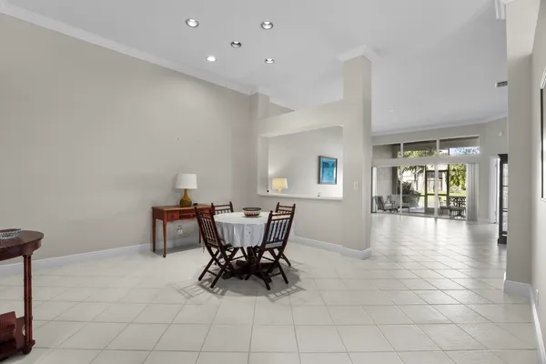 a view of a dining room with furniture and window