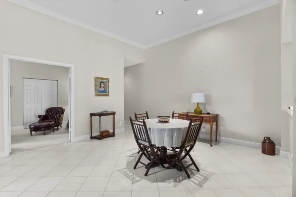 a living room with furniture potted plant and a window