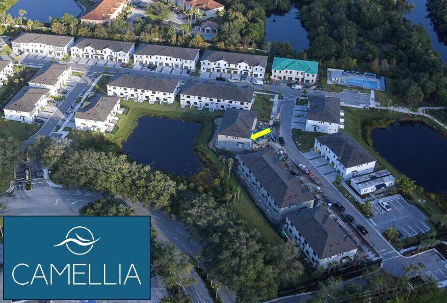 7776 Southwest Bentley Lane, Unit NAUTICAL 7414 Stuart, FL 34997 - Photo 2 of 22 an outdoor space with lots of palm trees