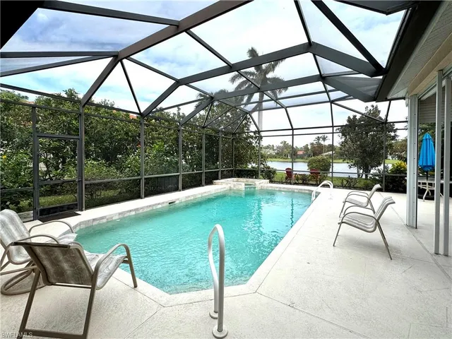 a view of swimming pool with a patio