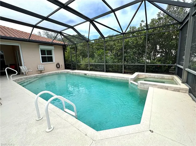 a view of a backyard with swimming pool