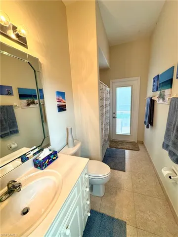 a bedroom with a bed and a table