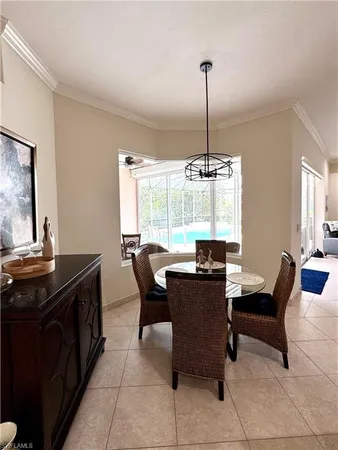 a living room with furniture a rug and a chandelier