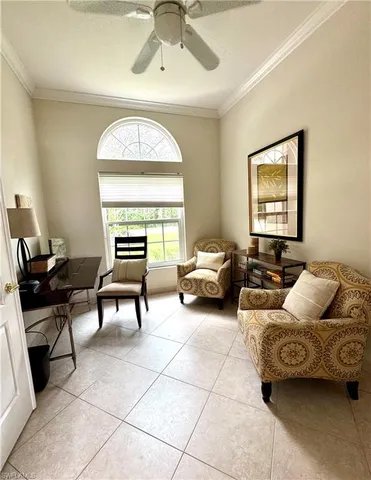 a living room with a couch and a window