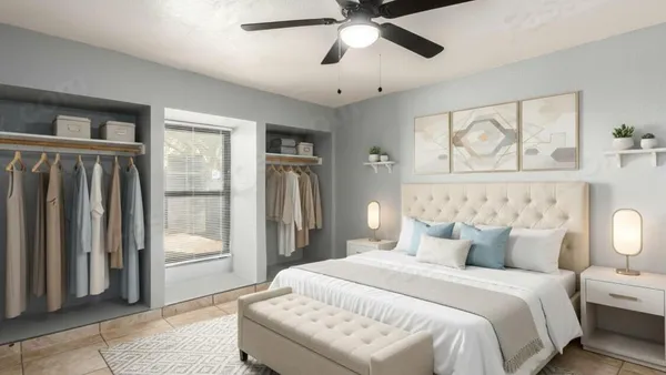 a spacious bedroom with a bed and a chandelier