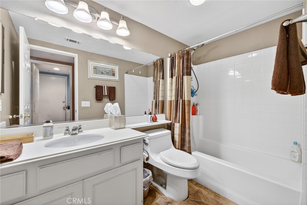 807 Lomond Drive Riverside, CA 92508 - Photo 23 of 47 Secondry hall leads from kitchen back to dining are and then to lower level full bathroom.